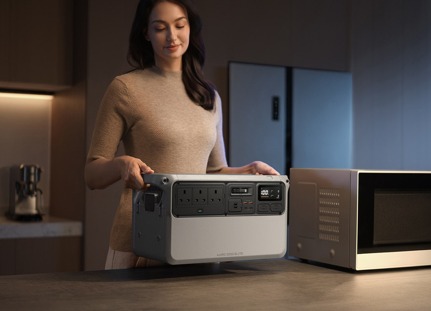Lifting the Auro 2000 Elite beside a microwave